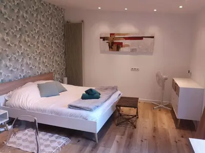 Un ou plusieurs lits dans un hébergement de l'établissement Studio neuf - accès SPA, SAUNA et Piscine Chauffée