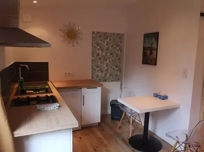 Cuisine ou kitchenette dans l'établissement Studio neuf - accès SPA, SAUNA et Piscine Chauffée