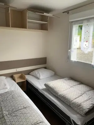Un ou plusieurs lits dans un hébergement de l'établissement Camping de Bourg Charente