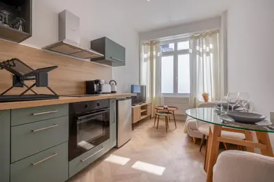 Cuisine ou kitchenette dans l'établissement La Perle Citadine En Hyper Centre