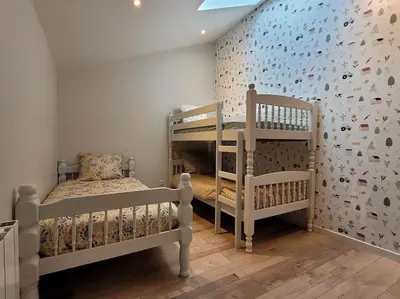 Un ou plusieurs lits dans un hébergement de l'établissement Maison Poitevine 9/10 personnes