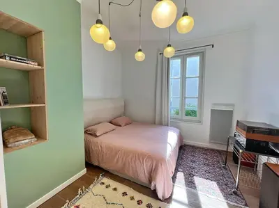 Un ou plusieurs lits dans un hébergement de l'établissement Le SeptièmeArt - Coeur de ville