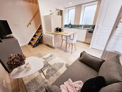 Coin salon dans l'établissement Côté cour chaleureuse maison de ville