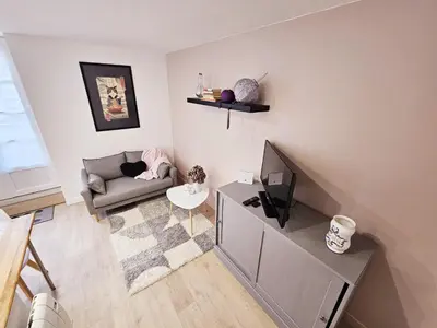 Coin salon dans l'établissement Côté cour chaleureuse maison de ville