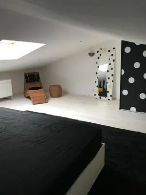 Un ou plusieurs lits dans un hébergement de l'établissement Au 29 logement cocon avec jacuzzi privatif