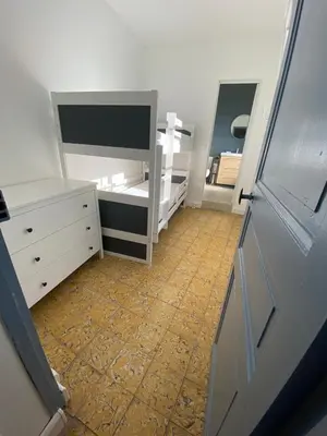 Un ou plusieurs lits dans un hébergement de l'établissement Maison 4 personnes avec Jardin, à 200 m de la Plage