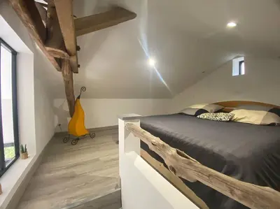 Un ou plusieurs lits dans un hébergement de l'établissement Maison de charme - proche Futuroscope