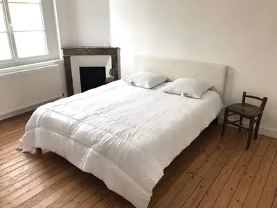 Un ou plusieurs lits dans un hébergement de l'établissement Maison de vacances