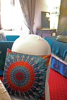 Un ou plusieurs lits dans un hébergement de l'établissement Le Chapeau Rouge