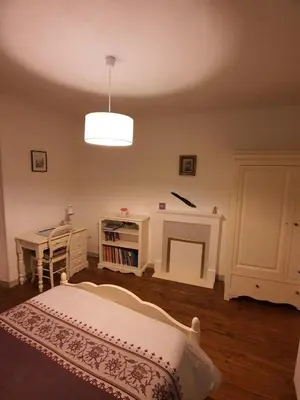 Un ou plusieurs lits dans un hébergement de l'établissement Maison d'hôtes du Faubourg Charrault Saint Maixent L'Ecole