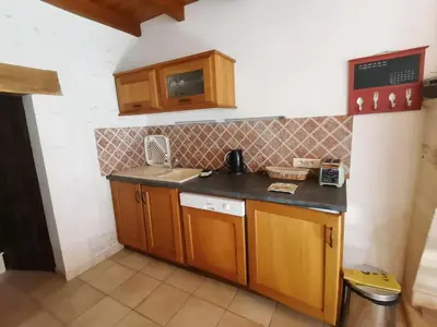 Cuisine ou kitchenette dans l'établissement Gîtes Le Chemin du Romarin