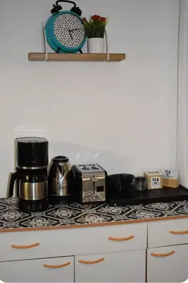 Cuisine ou kitchenette dans l'établissement Joli apartment proche du centre-ville