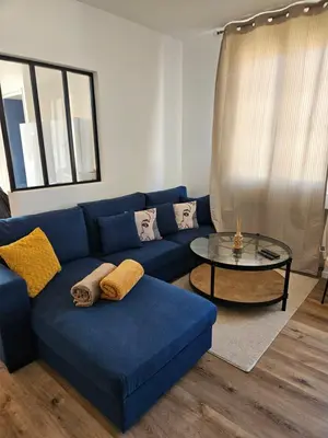 Coin salon dans l'établissement Maison spacieuse jardin Transat - Parking gratuit
