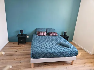 Un ou plusieurs lits dans un hébergement de l'établissement Maison spacieuse jardin Transat - Parking gratuit