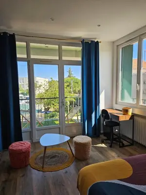Coin salon dans l'établissement Maison spacieuse jardin Transat - Parking gratuit