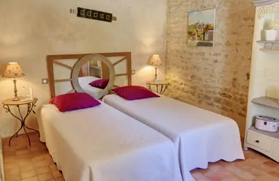 Un ou plusieurs lits dans un hébergement de l'établissement Le Petit Paradis