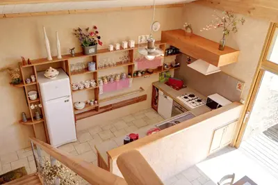 Cuisine ou kitchenette dans l'établissement Le Petit Paradis