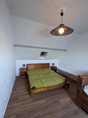 Un ou plusieurs lits dans un hébergement de l'établissement La maison de Joe