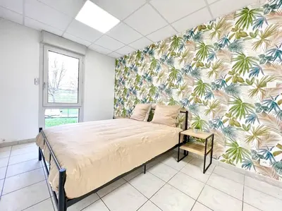 Un ou plusieurs lits dans un hébergement de l'établissement Le Grand Penon ~ Logement Spacieux à 6 min du Parc