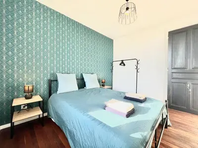 Un ou plusieurs lits dans un hébergement de l'établissement La Ribaudière Maison de ville à 5 min Futuroscope