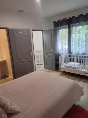 Un ou plusieurs lits dans un hébergement de l'établissement Charmante maison près du Futuroscope