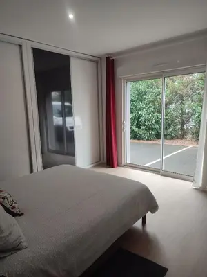 Un ou plusieurs lits dans un hébergement de l'établissement Charmante maison près du Futuroscope