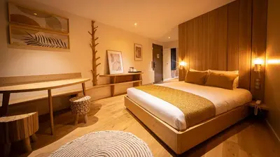 Un ou plusieurs lits dans un hébergement de l'établissement Hôtel Ecolodgee