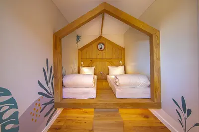 Un ou plusieurs lits dans un hébergement de l'établissement Hôtel Ecolodgee