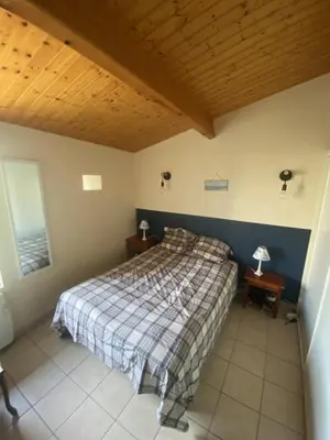 Un ou plusieurs lits dans un hébergement de l'établissement le Domaine du Petit Bois, Gîte le Marronnier