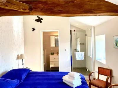Un ou plusieurs lits dans un hébergement de l'établissement Aux Agapanthes, Chambres d'Hôtes charentaises de charme avec piscine