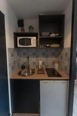Cuisine ou kitchenette dans l'établissement Appartement avec parking - Futuroscope - 1 à 4 personnes