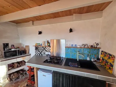 Cuisine ou kitchenette dans l'établissement La Chabourne des remparts