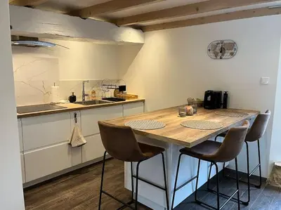 Cuisine ou kitchenette dans l'établissement La Petite Maison - La Grange des Colporteurs