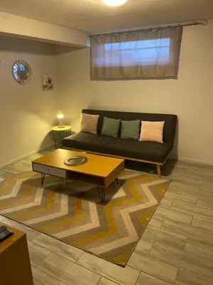 Coin salon dans l'établissement Appartement F2 proche Futuroscope