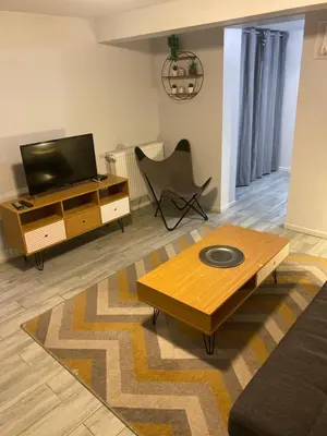 Télévision ou salle de divertissement dans l'établissement Appartement F2 proche Futuroscope