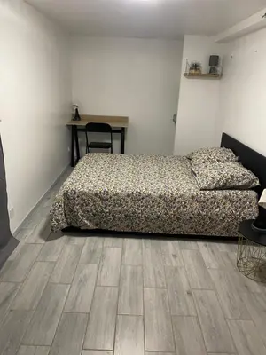 Un ou plusieurs lits dans un hébergement de l'établissement Appartement F2 proche Futuroscope
