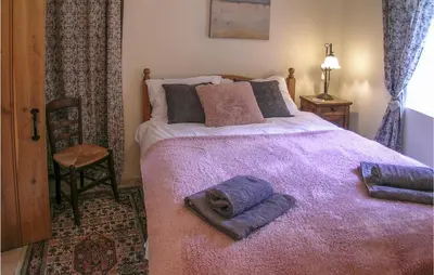 Un ou plusieurs lits dans un hébergement de l'établissement Amazing Home In Suaux