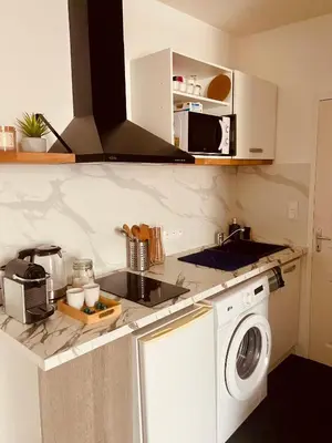 Cuisine ou kitchenette dans l'établissement Le Bellevue - Spacieux et calme