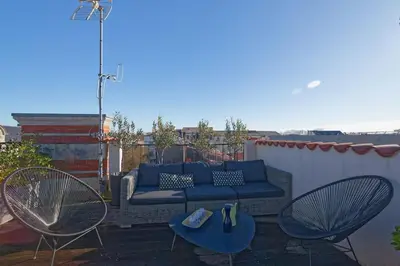 Balcon ou terrasse dans l'établissement L'Olympe - triplex avec spa et rooftop Classé 4*