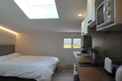 Un ou plusieurs lits dans un hébergement de l'établissement Maison Meire Studios
