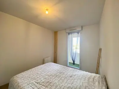 Un ou plusieurs lits dans un hébergement de l'établissement La Coquille: bright, cozy, 3 min from Parc Expo