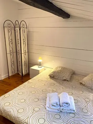 Un ou plusieurs lits dans un hébergement de l'établissement Le Clain de Vivonne, cosy appartement plein centre