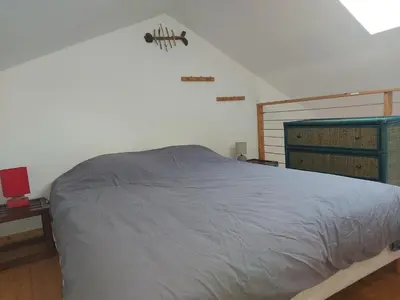 Un ou plusieurs lits dans un hébergement de l'établissement chambre les minimes bord de mer aytré