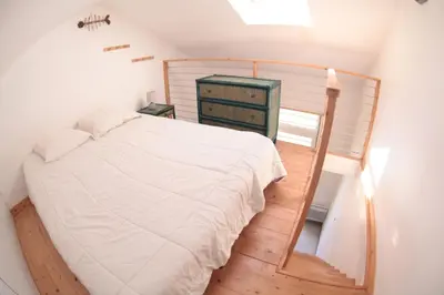 Un ou plusieurs lits dans un hébergement de l'établissement chambre les minimes bord de mer aytré