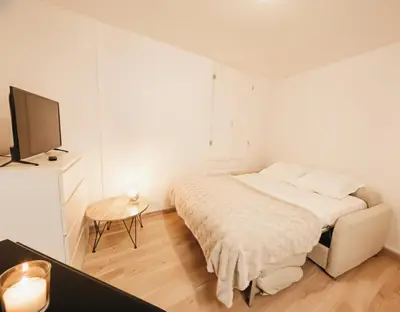 Un ou plusieurs lits dans un hébergement de l'établissement Studio paisible proche centre