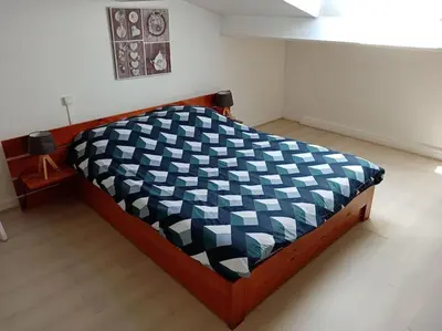 Un ou plusieurs lits dans un hébergement de l'établissement Petite maison avec jardin