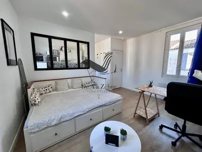Un ou plusieurs lits dans un hébergement de l'établissement Le Moderne - Appartement situé en plein centre-ville