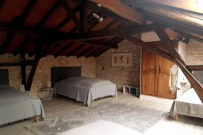 Un ou plusieurs lits dans un hébergement de l'établissement Gîte du Louvanto