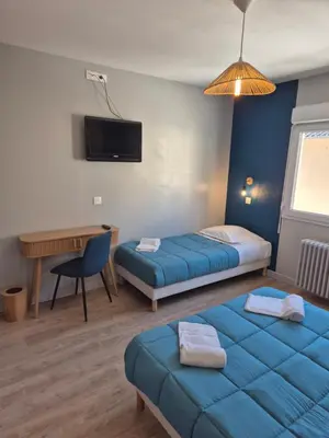 Un ou plusieurs lits dans un hébergement de l'établissement Hôtel Ecu de france