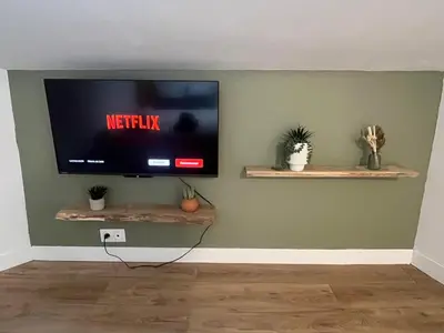 Télévision ou salle de divertissement dans l'établissement Sous les toits du parvis
